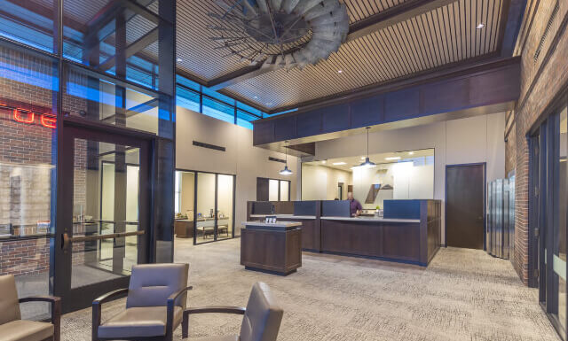 Front Lobby of a Bank with Rustic Decor and An Overall Warm Vibe